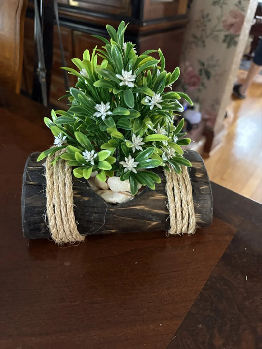 Faux Green Boxwood with White Blossoms in Rustic Black Log Planter